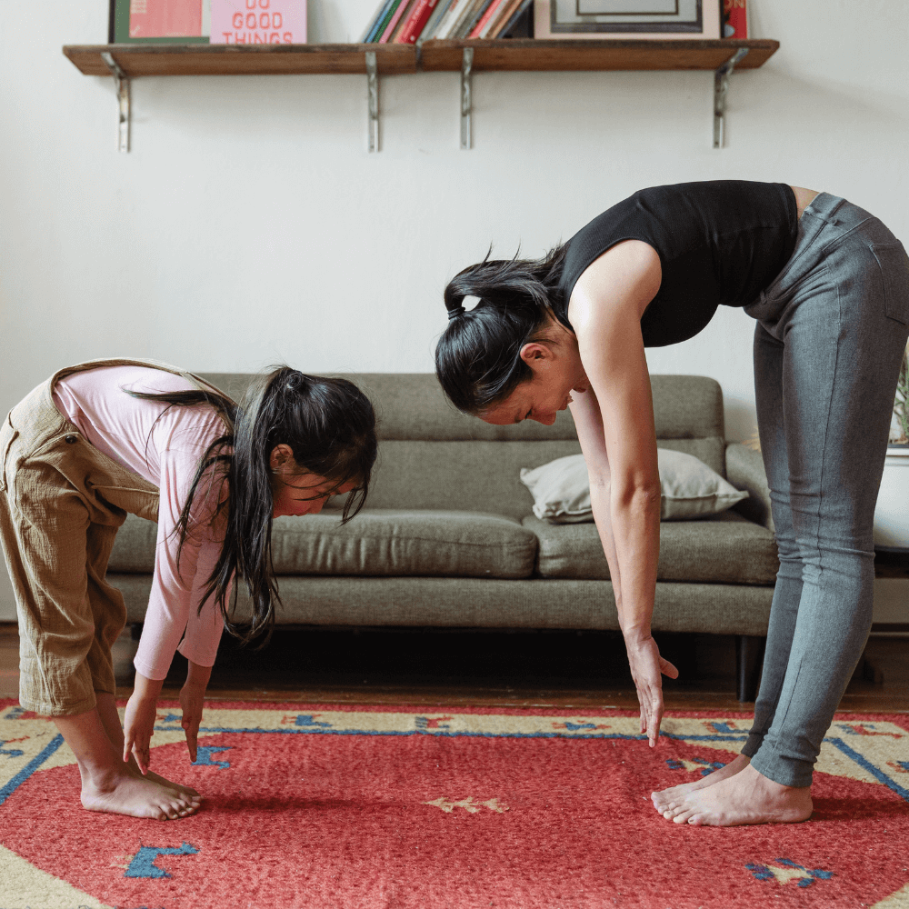 A mom and her child practicing yoga