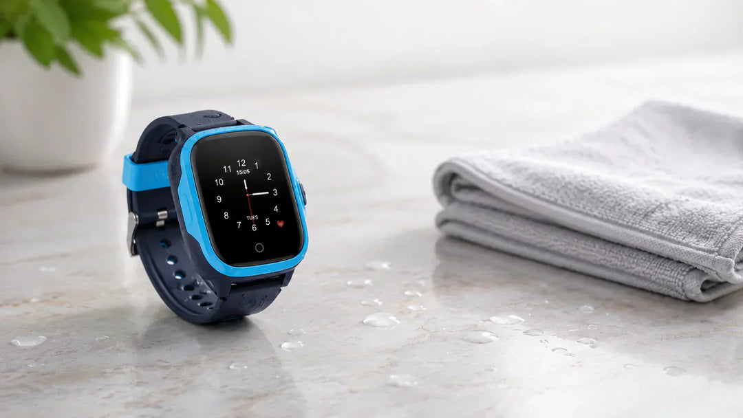 Lil Tracker GPS watch with water droplets beside a towel, illustrating IP67 water resistance and what to do if a smartwatch gets wet.