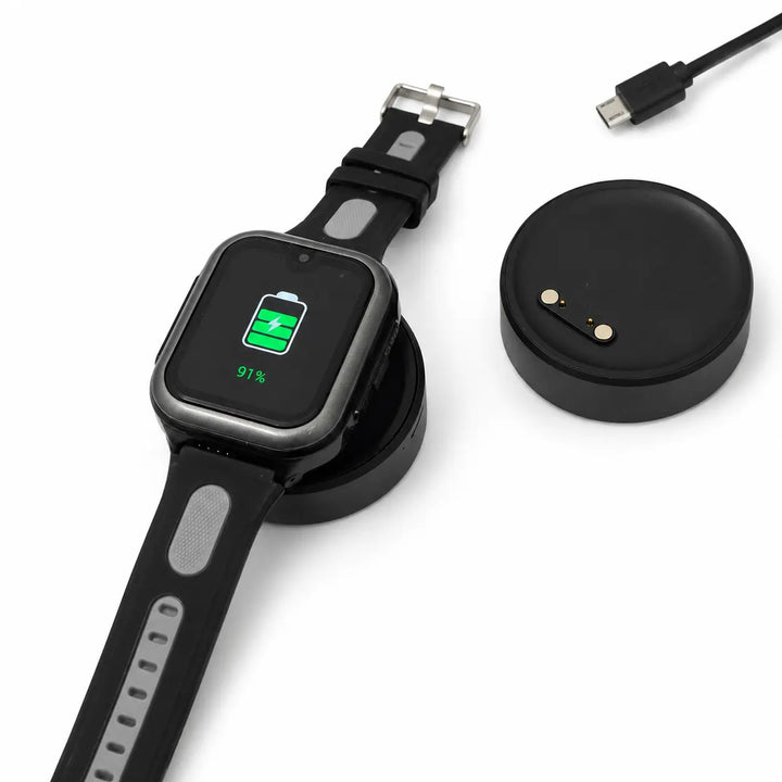 Lil Tracker GPS watch charging on portable cordless charging dock